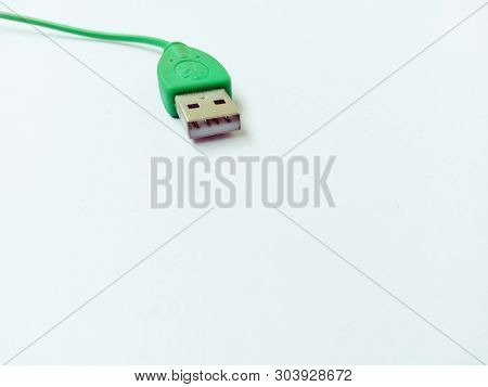 Usb Green Cable Placed On A Green Table