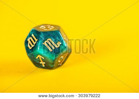 Astrology Dice With Zodiac Symbol Of Scorpio Oct 23 - Nov 21 On Yellow Background