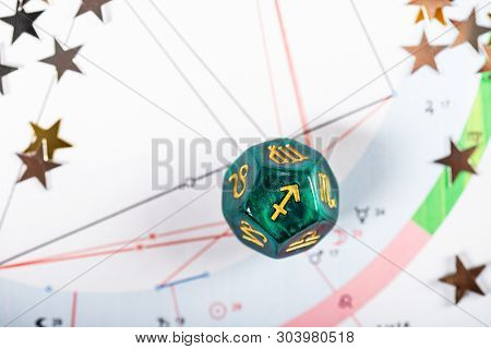 Astrology Dice With Zodiac Symbol Of Sagittarius Nov 22 - Dec 21 On Natal Chart Background