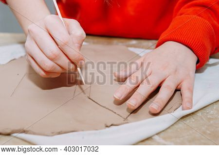Womens Hands Knead Clay, Drawing Elements Of The Product. Production Of Ceramic Products At The Mast