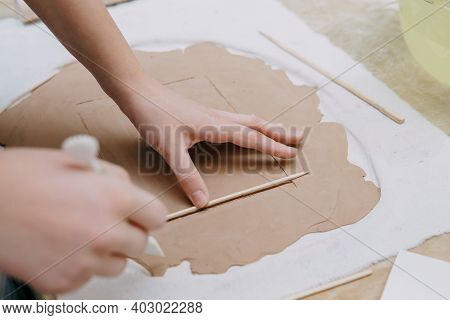 Womens Hands Knead Clay, Drawing Elements Of The Product. Production Of Ceramic Products At The Mast