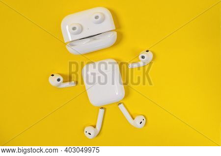 Rostov, Russia - July 06, 2020: Funny Little Man With Arms, Legs And Eyes Made Of Apple Wireless Hea