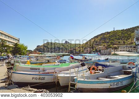 Balaklava, Sevastopol, Crimea, Russia-june 02, 2018: Boats And Boats Moored To The Shore Of Balaklav
