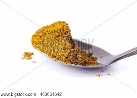 Pile Of Khmeli Suneli On A Spoon Isolated On White. Georgian Food Condiments