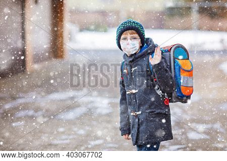 Little Kid Boy With Glasses Wearing Medical Mask On The Way To School After Lockdown. Child Backpack
