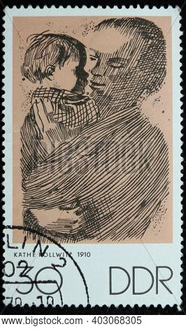 Istanbul, Turkey - December 26, 2020: German Democratic Republic Stamp Shows Mother And Child By Kat