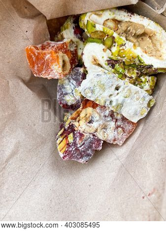 Rahat Lakoum In Paper Bag. Traditional Turkish Dessert. Sweet Snack Food. Vertical Mobile Traveling 