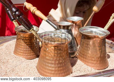 The Turkish Coffee In Cezve In The Hot Sand