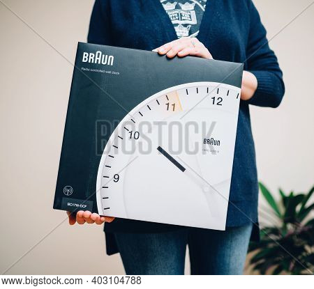 Paris, France - Dec 13, 2020: Hands Showing Presenting New Braun Bc17w-dcf Radio Controlled Wall Clo