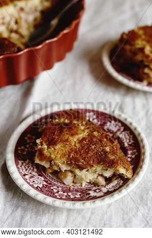 Apple And Cheese Cobbler Crisp. Cobbler Or Crumble Dessert With Apples In Ceramic Baking Form On Bei