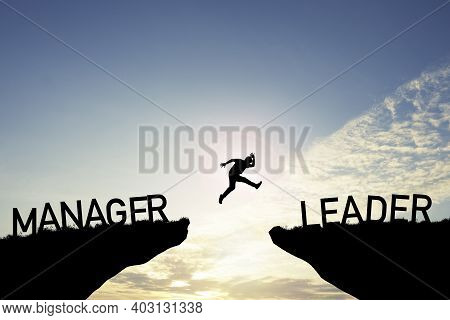 Silhouette Man Jumping From Manager Cliff To Leader Cliff On Cloud And Blue Sky. Change Behaviour An