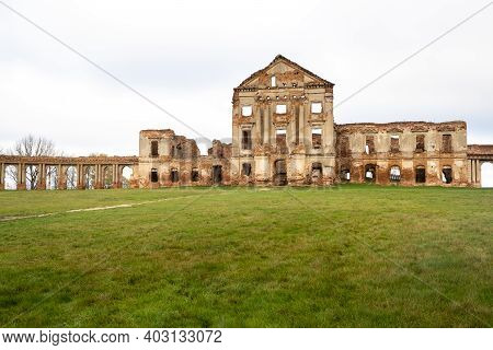 Ruzhansky Palace And The Ruins Of The Facade Of An Abandoned Ruined Building Of An Ancient Castle Of