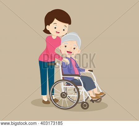 Elderly Woman Sit In A Wheelchair And The Daughter Tenderly Puts  Hands On Her Shoulders.daughter Ca