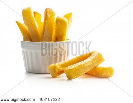 Big french fries. Fried potato chips isolated on white background.