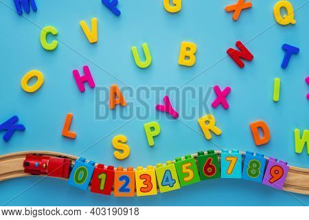 Educational Toys Blocks, Numbers, Letters, Train On Blue Background. Toys For Kindergarten, Preschoo