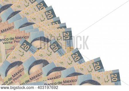 20 Mexican Pesos Bills Lies Isolated On White Background With Copy Space Stacked In Fan Close Up. Pa