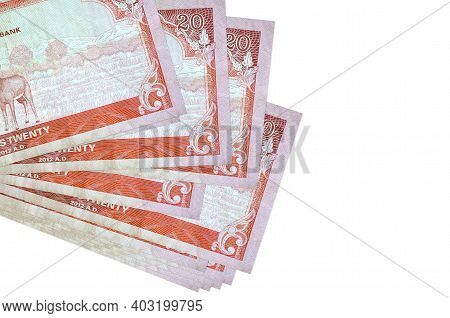 20 Nepalese Rupees Bills Lies In Small Bunch Or Pack Isolated On White. Mockup With Copy Space. Busi