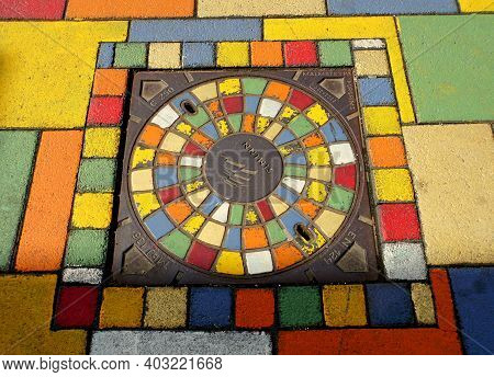Reykjavik, Iceland - June 20, 2019 - A Colorful Utility Hole On A Street In The City