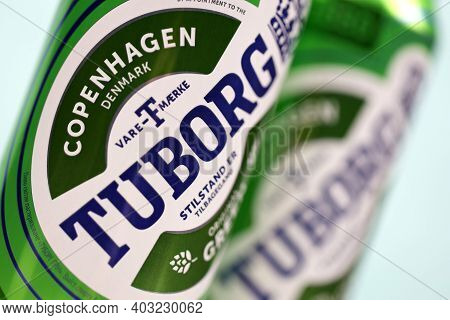 Kharkov, Ukraine - December 8, 2020: Aluminium Cans Of Green Tuborg Beer On Wooden Background. Tubor