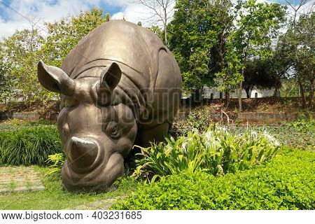 Front View Of A Rhino Statue In The Grounds Of Gwk Park, Bali, Indonesia. Big Rhino Statue In Garuda