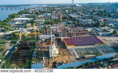Aerial Top View Of Industrial Park Zone From Above, Factory Chimneys And Warehouses, Industry Distri