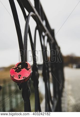 Red Heart Shaped Keylock On A Fence