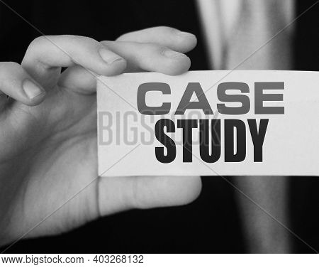 Case Study, Message On White Card In Hand Of Businessman.