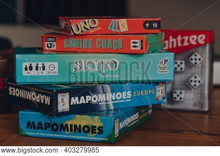Combe St Nicholas, Uk - July 25, 2020: Stack Of Modern And Classing Board Games On A Table. Sales Of