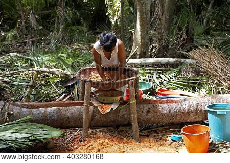 Warao Woman Doing Bread With Flour Made From Palmtree, Mauritia Flexulosa, Indians Living In Orinoco