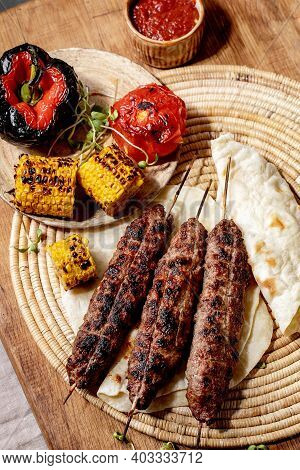Eastern Fast Food. Grilled Beef Lyulya Kebab On Sticks On Flat Bread With Grilled Vegetables Sweet C