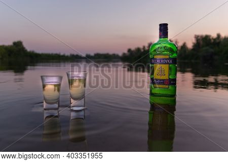 Kyiv, Ukraine - Aug 7, 2020: The Original Becherovka. A Bottle Of Becherovka And Two Glasses On The 