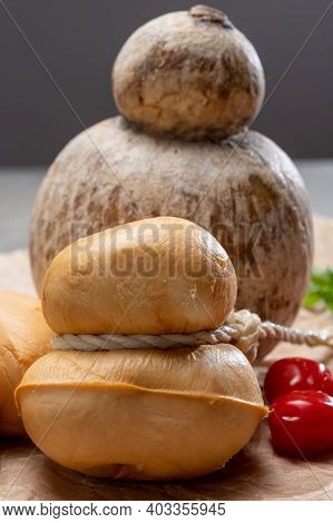Italian Semi Hard Handmade Smoked Scamorza And Caciocavallo Matured In Caves Cheeses Made From Cow M