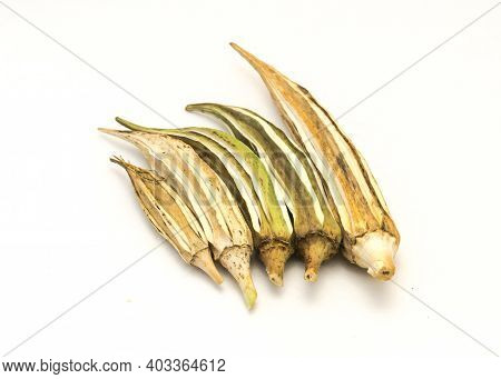 Five Matured And Dried Okra Pod For Saving Seeds Studio Shot Isolated On White Background