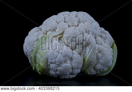 Cauliflower Isolated On A Black Background With A Copy Space