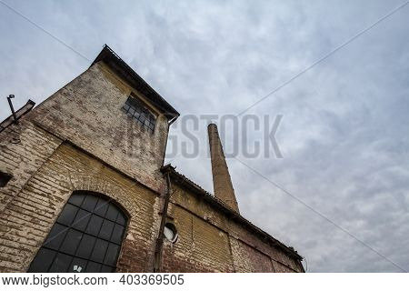 Abandoned Factory And Warehouse With Its Distinctive Brick Chimney In Eastern Europe, In Belgrade Se