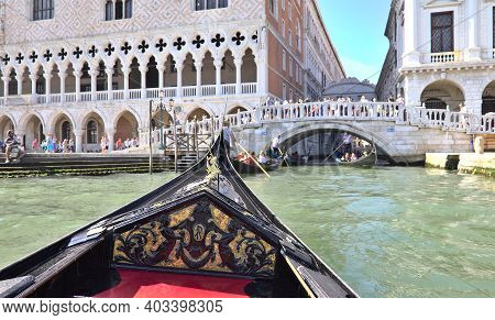 Venice, Italy - 3 August, 2016: Tourists Enjoying The Gondolas In The Canals Near The Bridge Of Sigh