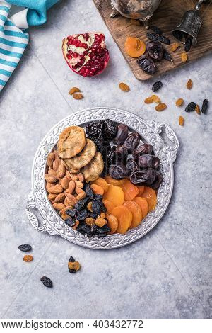 Assortment Of Nuts And Dried Fruits. Dried Fruits And Nuts Mix In A Wooden Bowl. Assortment Of Candi