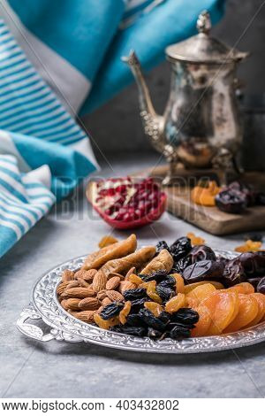 Assortment Of Nuts And Dried Fruits. Dried Fruits And Nuts Mix In A Wooden Bowl. Assortment Of Candi