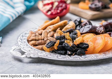 Assortment Of Nuts And Dried Fruits. Dried Fruits And Nuts Mix In A Wooden Bowl. Assortment Of Candi