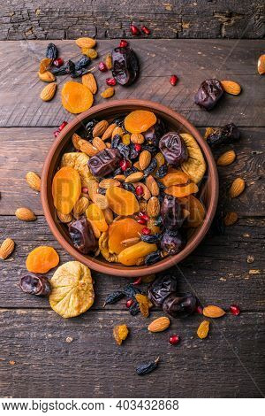 Assortment Of Nuts And Dried Fruits. Dried Fruits And Nuts Mix In A Wooden Bowl. Assortment Of Candi