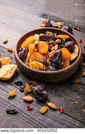 Dried Fruits And Nuts Mix In A Wooden Bowl. Assortment Of Candied Fruits. Judaic Holiday Tu Bishvat.