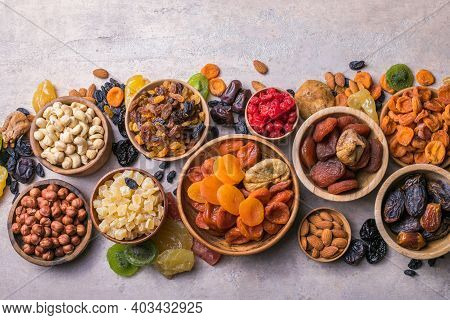 Dried Fruits And Nuts Mix In A Wooden Bowl. Assortment Of Candied Fruits. Judaic Holiday Tu Bishvat.