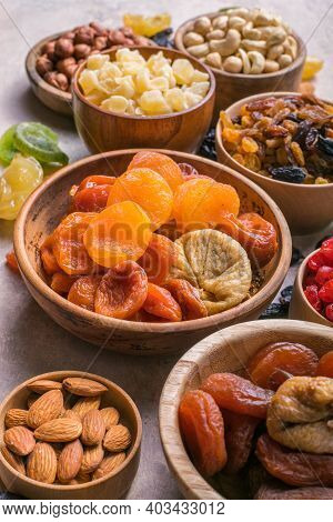 Assortment Of Nuts And Dried Fruits. Dried Fruits And Nuts Mix In A Wooden Bowl. Assortment Of Candi