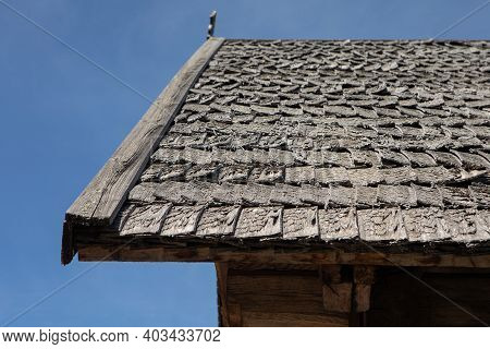 A Shingle Roof In Lithuania, Zalgiris Village. Traditional Roofing Of Ancient Houses.