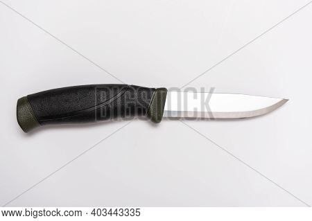 Fixed Blade Knife. Knife With Rubber Handle. Knife On A Gray Background.