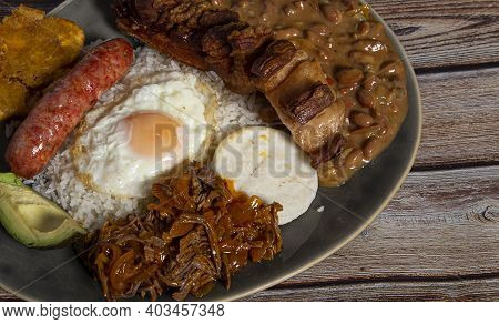 Variety Of Typical Dishes Of Colombian Gastronomy. Picada, Tripe, San Cocho, Paisa Tray.