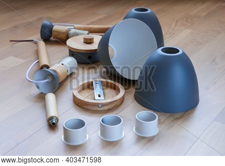 Assembling Furniture At Home. Self-assembly Of The Chandelier. Details Of The Luster Laid Out On The