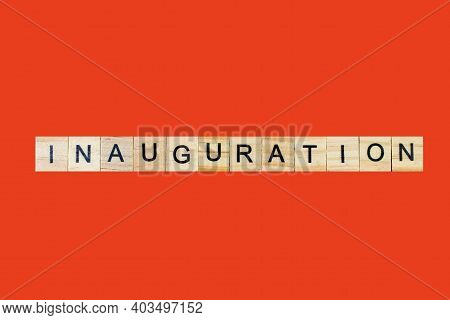 Inauguration . English Word On Red Background Composed From Letters On Wooden Cubes. Learning Englis