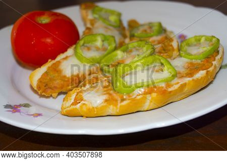 Hot Sandwich, Crescent Filled With Parizer Cream On A Dish