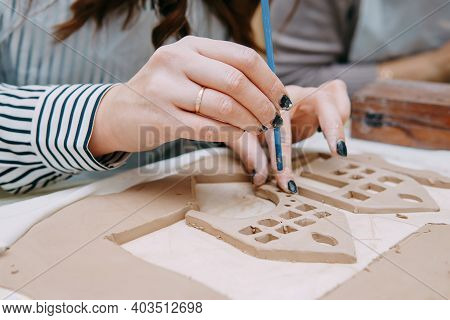 Womens Hands Knead Clay, Drawing Elements Of The Product. Production Of Ceramic Products At The Mast
